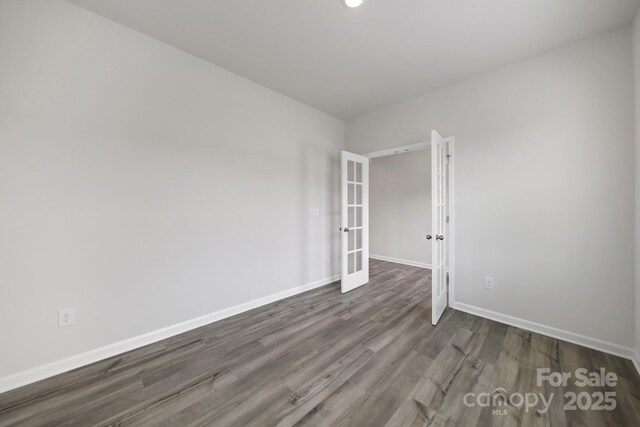 300 Kennerly Center Dr, Mooresville, NC 28115 - spare room with french doors, wood finished floors, baseboards, and recessed lighting