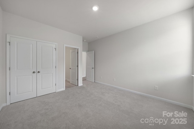 300 Kennerly Center Dr, Mooresville, NC 28115 - unfurnished bedroom with carpet floors, baseboards, and a closet
