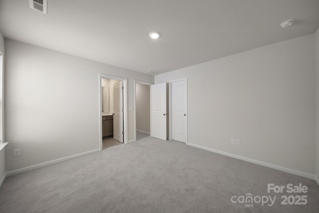 300 Kennerly Center Dr, Mooresville, NC 28115 - unfurnished bedroom with light carpet, baseboards, connected bathroom, and recessed lighting