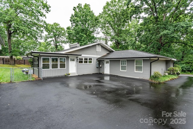 1035 15th Ave NW, Hickory, NC 28601 - tri-level home with a chimney, driveway, and a shingled roof