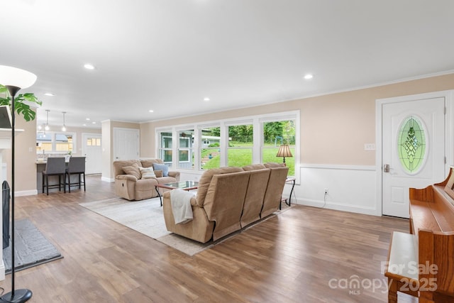1035 15th Ave NW, Hickory, NC 28601 - living area featuring crown molding, wood finished floors, recessed lighting, and baseboards