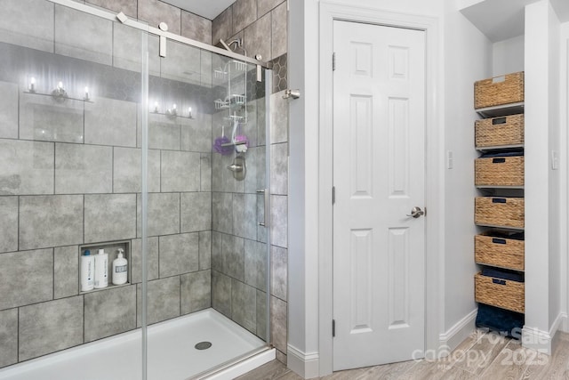1035 15th Ave NW, Hickory, NC 28601 - full bath with a stall shower, baseboards, and wood finished floors