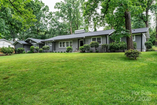1035 15th Ave NW, Hickory, NC 28601 - ranch-style house with a front lawn, a chimney, and brick siding