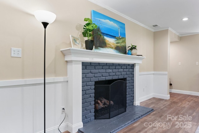 1035 15th Ave NW, Hickory, NC 28601 - detailed view of wood finished floors, crown molding, a fireplace, recessed lighting, and baseboards