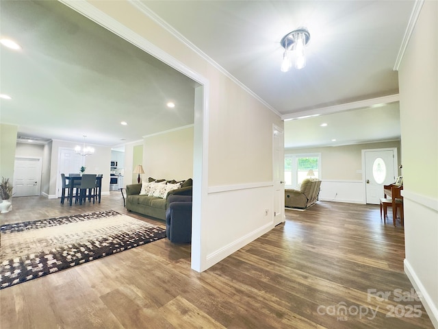 1035 15th Ave NW, Hickory, NC 28601 - living room with a chandelier, wood finished floors, ornamental molding, recessed lighting, and baseboards