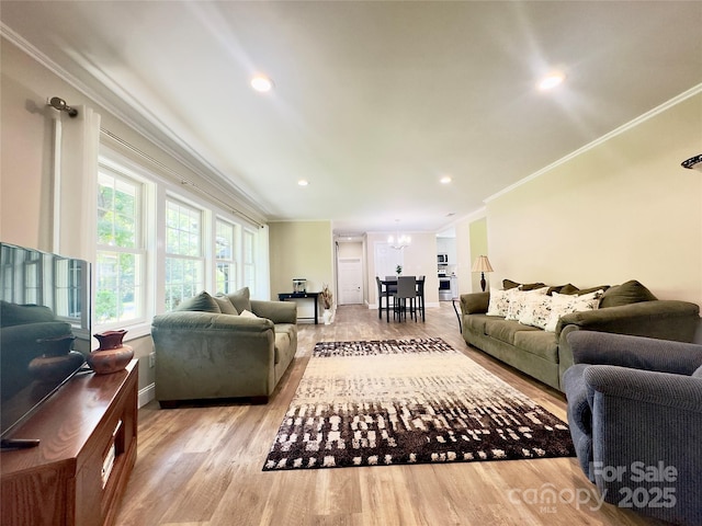 1035 15th Ave NW, Hickory, NC 28601 - living room featuring crown molding, a chandelier, light wood-type flooring, baseboards, and recessed lighting