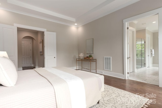 3009 Ocaso Ct, Matthews, NC 28104 - bedroom with arched walkways, wood finished floors, baseboards, and recessed lighting