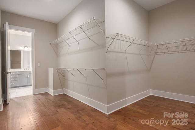 3009 Ocaso Ct, Matthews, NC 28104 - walk in closet featuring wood finished floors