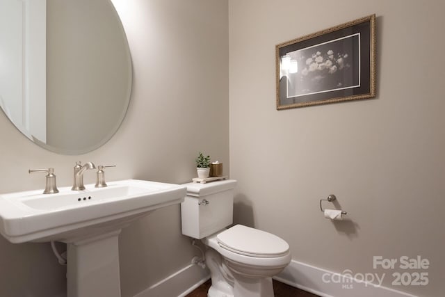 3009 Ocaso Ct, Matthews, NC 28104 - half bath with toilet and baseboards
