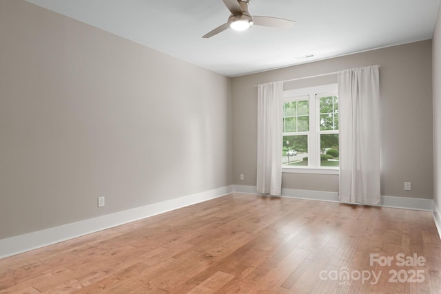 3009 Ocaso Ct, Matthews, NC 28104 - spare room featuring a ceiling fan, light wood-style flooring, and baseboards