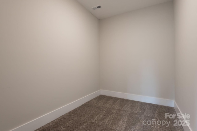3009 Ocaso Ct, Matthews, NC 28104 - empty room featuring dark carpet and baseboards