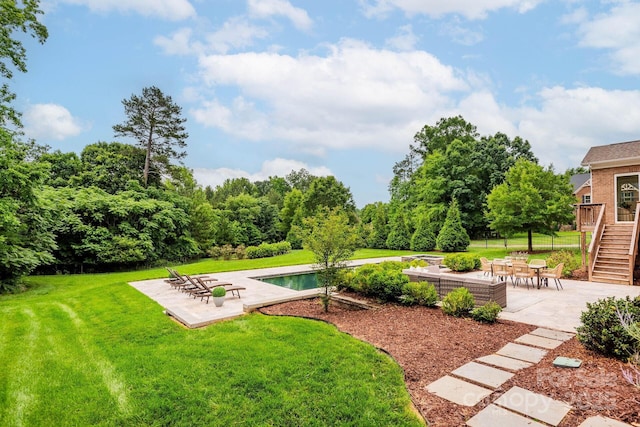 3009 Ocaso Ct, Matthews, NC 28104 - view of grassy yard with stairway, a patio, and an outdoor pool