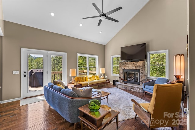 2508 Wolf Pit Rd, Morganton, NC 28655 - living area with high vaulted ceiling, a stone fireplace, ceiling fan, wood finished floors, and recessed lighting