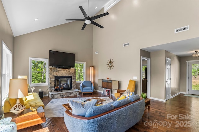 2508 Wolf Pit Rd, Morganton, NC 28655 - living area featuring high vaulted ceiling, a stone fireplace, wood finished floors, baseboards, and a ceiling fan