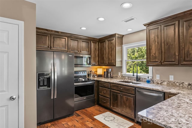 2508 Wolf Pit Rd, Morganton, NC 28655 - kitchen with stainless steel appliances, a sink, dark brown cabinetry, and recessed lighting