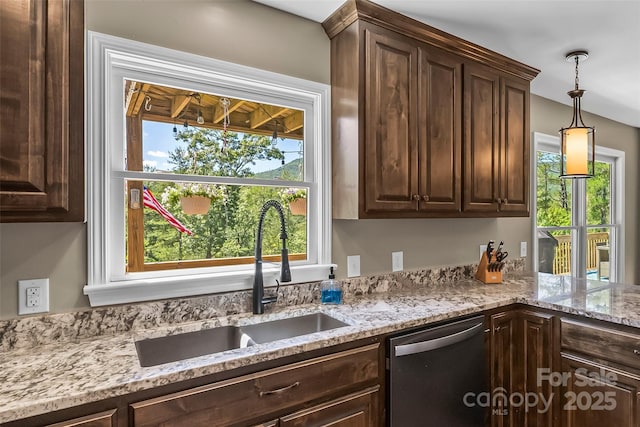 2508 Wolf Pit Rd, Morganton, NC 28655 - kitchen with stainless steel dishwasher, a sink, and dark brown cabinetry