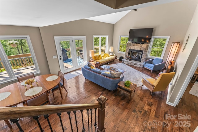 2508 Wolf Pit Rd, Morganton, NC 28655 - living room featuring hardwood / wood-style floors, a fireplace, vaulted ceiling, and baseboards