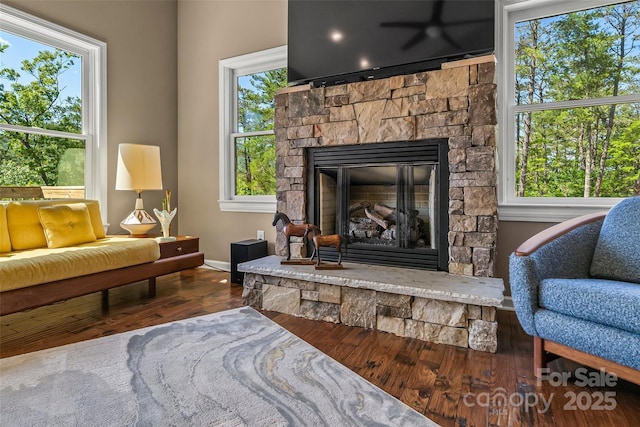 2508 Wolf Pit Rd, Morganton, NC 28655 - sitting room with wood finished floors, a fireplace, and baseboards