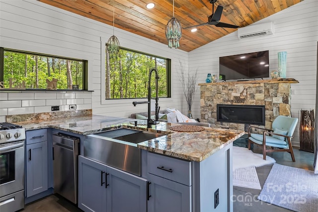 2508 Wolf Pit Rd, Morganton, NC 28655 - kitchen featuring appliances with stainless steel finishes, vaulted ceiling, wood ceiling, a sink, and an AC wall unit