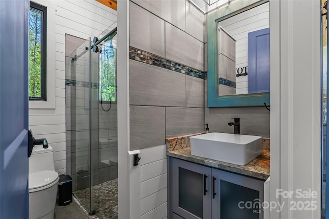 2508 Wolf Pit Rd, Morganton, NC 28655 - full bathroom featuring toilet, tile walls, a shower stall, and vanity