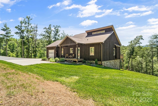2508 Wolf Pit Rd, Morganton, NC 28655 - view of front of house featuring an attached garage, concrete driveway, a front yard, and a shingled roof