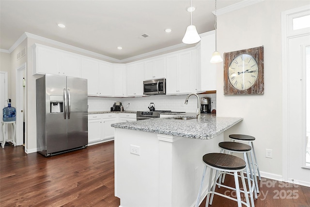 109 Mac Aly, Cramerton, NC 28032 - kitchen with appliances with stainless steel finishes, a sink, a peninsula, ornamental molding, and light stone counters