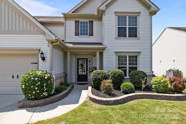 1035 Ivey Ct, Indian Land, SC 29707 - townhome / multi-family property featuring board and batten siding, an attached garage, a shingled roof, and a front yard