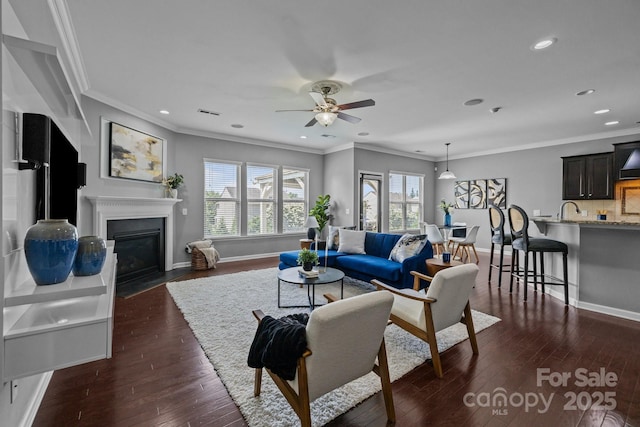 1035 Ivey Ct, Indian Land, SC 29707 - living area with ceiling fan, dark wood-style flooring, recessed lighting, baseboards, and crown molding