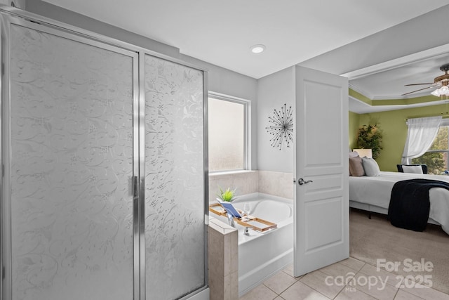 1035 Ivey Ct, Indian Land, SC 29707 - bathroom featuring ensuite bath, tile patterned floors, a garden tub, a shower stall, and a ceiling fan