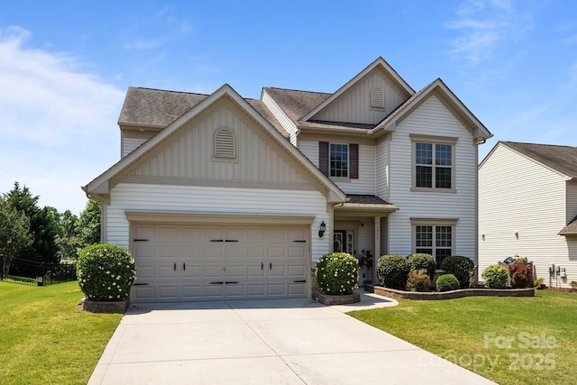 1035 Ivey Ct, Indian Land, SC 29707 - view of front of property with board and batten siding, driveway, a front lawn, a garage, and a shingled roof