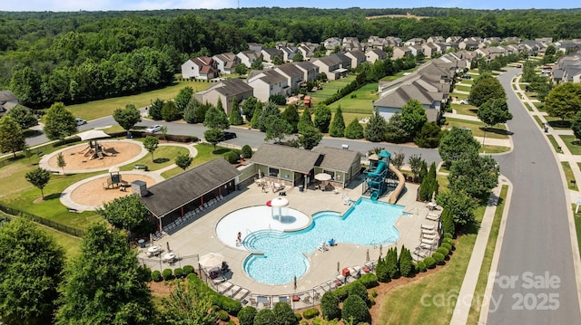 1035 Ivey Ct, Indian Land, SC 29707 - aerial view of residential area featuring a pool and a heavily wooded area