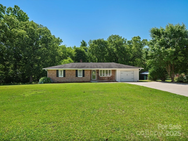 2451 Robert H Kirk Rd, Lancaster, SC 29720 - ranch-style house featuring concrete driveway, a garage, a front yard, and brick siding