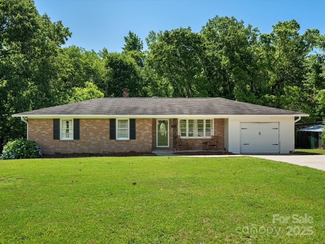 2451 Robert H Kirk Rd, Lancaster, SC 29720 - single story home with driveway, a garage, brick siding, and a front yard