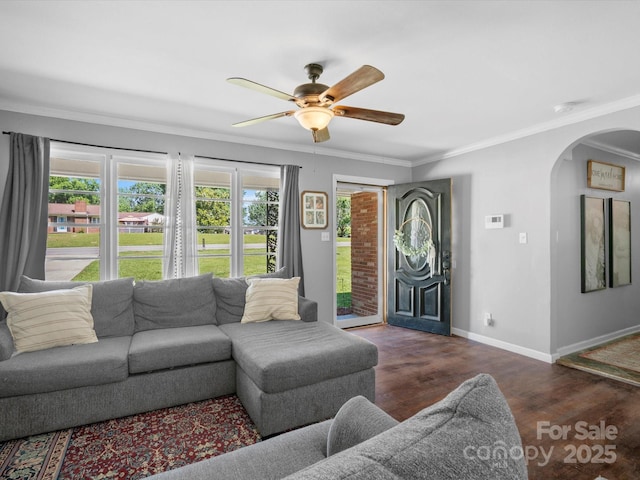 2451 Robert H Kirk Rd, Lancaster, SC 29720 - living room with arched walkways, ornamental molding, ceiling fan, wood finished floors, and baseboards