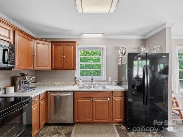 2451 Robert H Kirk Rd, Lancaster, SC 29720 - kitchen with black appliances, a sink, crown molding, and brown cabinetry