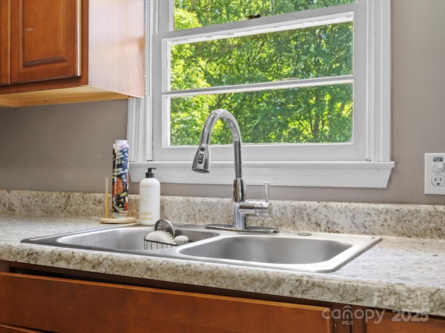 2451 Robert H Kirk Rd, Lancaster, SC 29720 - kitchen view of a sink, light countertops, and brown cabinets