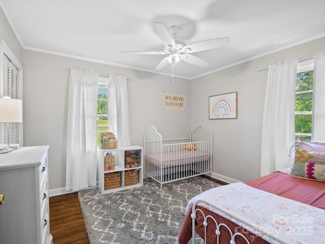 2451 Robert H Kirk Rd, Lancaster, SC 29720 - bedroom featuring multiple windows, ornamental molding, dark wood finished floors, and baseboards