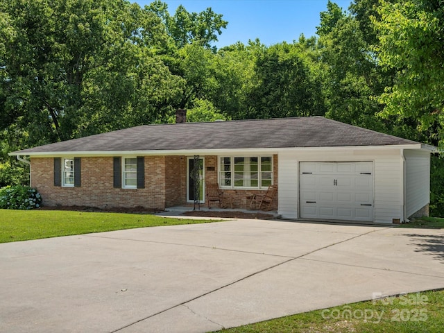 2451 Robert H Kirk Rd, Lancaster, SC 29720 - ranch-style home featuring concrete driveway, an attached garage, brick siding, and a front yard
