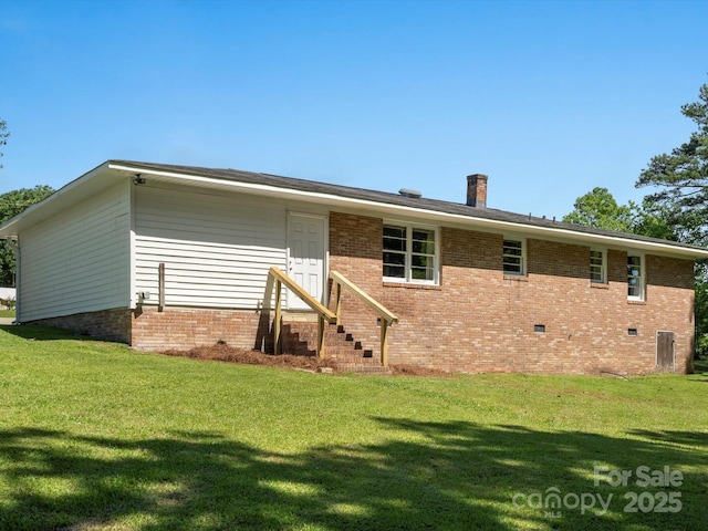 2451 Robert H Kirk Rd, Lancaster, SC 29720 - back of property featuring entry steps, a lawn, brick siding, and a chimney