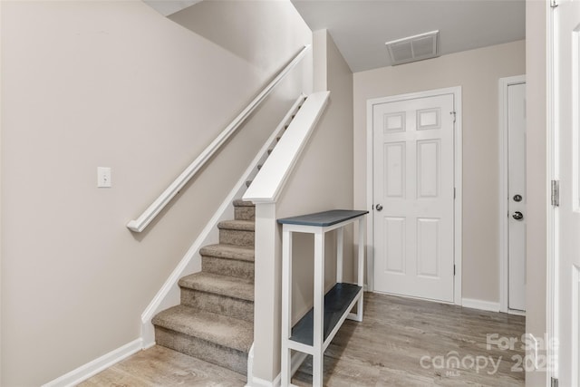 9651 Bailey Rd, Cornelius, NC 28031 - stairs featuring wood finished floors and baseboards
