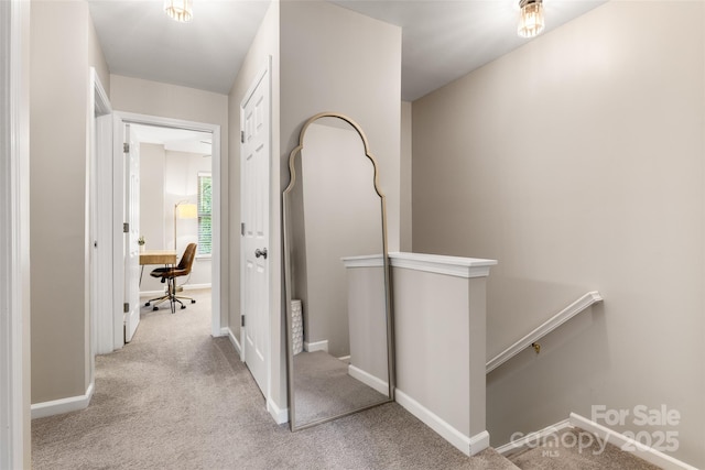 9651 Bailey Rd, Cornelius, NC 28031 - hallway with an upstairs landing, carpet floors, and baseboards