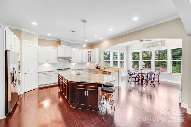8070 Clems Branch Rd, Indian Land, SC 29707 - kitchen with stainless steel refrigerator with ice dispenser, plenty of natural light, cooktop, a kitchen breakfast bar, and lofted ceiling