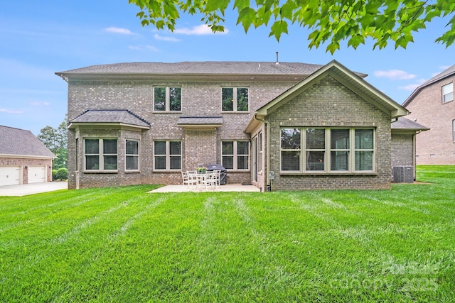 8070 Clems Branch Rd, Indian Land, SC 29707 - rear view of house with brick siding, a patio, a yard, central AC unit, and a garage