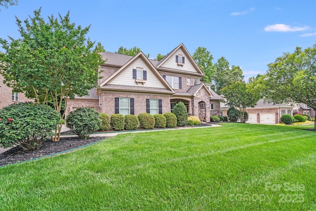 8070 Clems Branch Rd, Indian Land, SC 29707 - view of front of house with a front yard, brick siding, and a garage