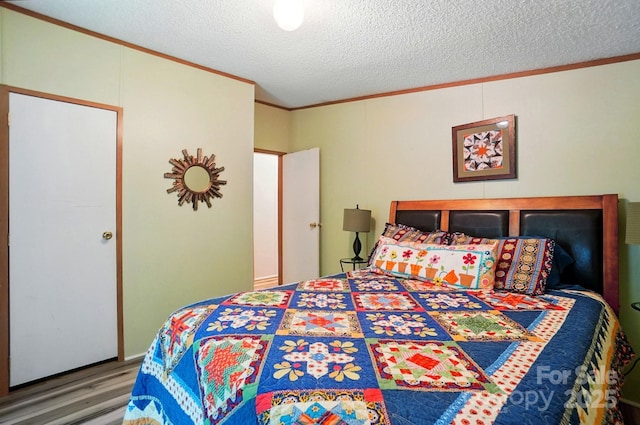 231 Valley View Dr, Clover, SC 29710 - bedroom featuring crown molding, wood finished floors, and a textured ceiling