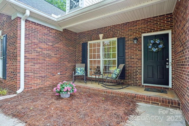 105 Prairie Rose Ct, Waxhaw, NC 28173 - property entrance with brick siding and covered porch