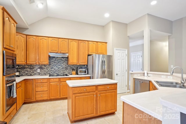 105 Prairie Rose Ct, Waxhaw, NC 28173 - kitchen featuring stainless steel appliances, a sink, a center island, decorative backsplash, and light countertops