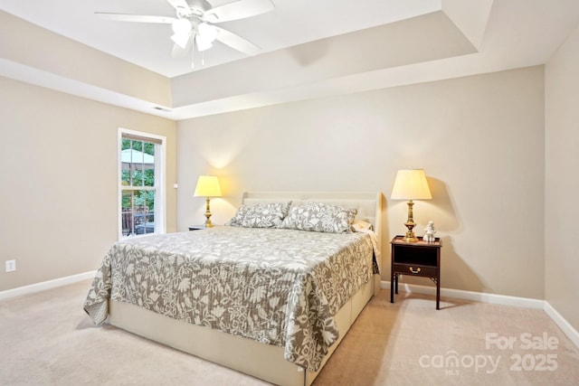 105 Prairie Rose Ct, Waxhaw, NC 28173 - bedroom featuring light carpet, baseboards, a raised ceiling, and a ceiling fan