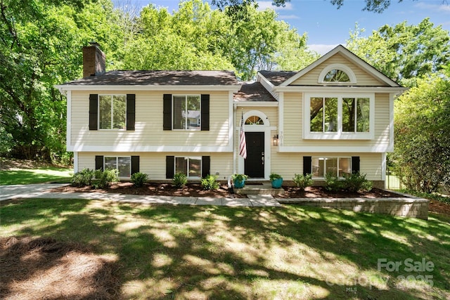 7018 Rollingridge Dr, Charlotte, NC 28211 - split foyer home with a chimney and a front yard