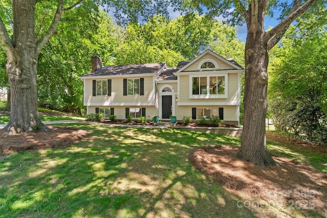 7018 Rollingridge Dr, Charlotte, NC 28211 - raised ranch featuring a chimney and a front yard